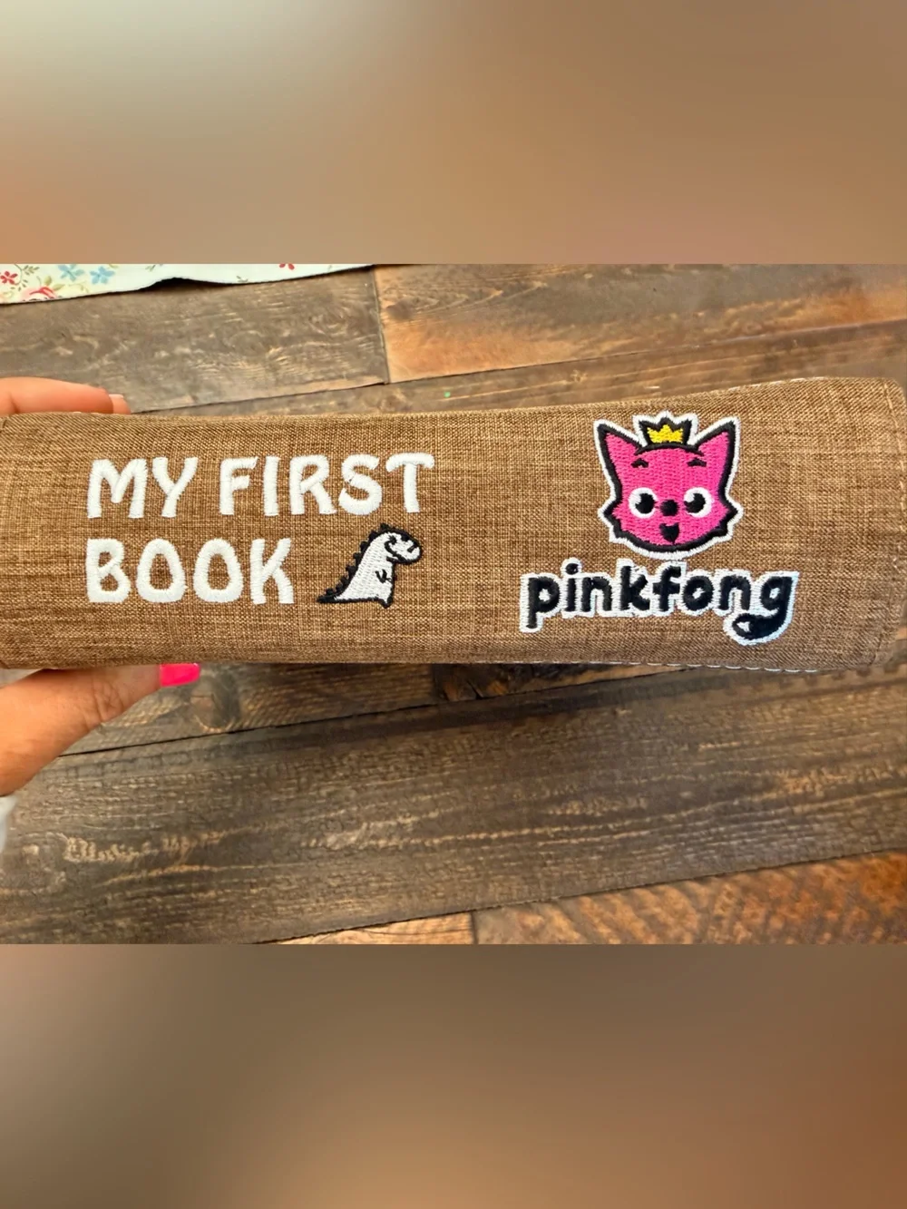 Pinkfong My First Book T-Rex, a Montessori-inspired interactive fabric busy book